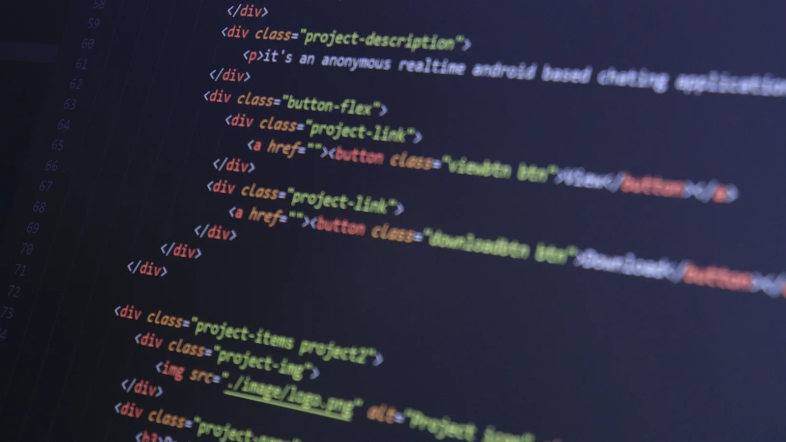 Close-up of HTML code with syntax highlighting on a computer monitor.