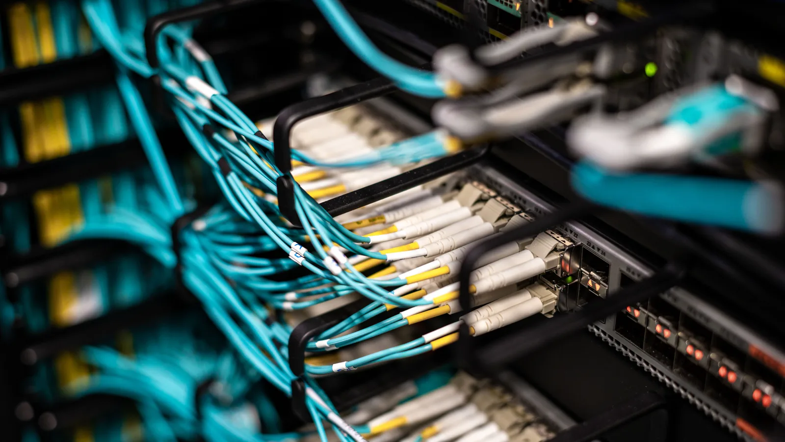Numerous wires and cables mounted into server patch panel in modern data center