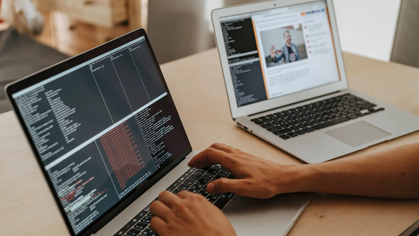 A developer working on a laptop, typing code, showcasing programming and technology skills.